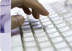 Image of hand on computer keyboard